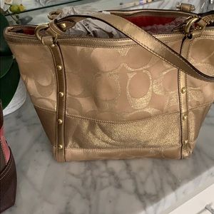 Gold coach bag